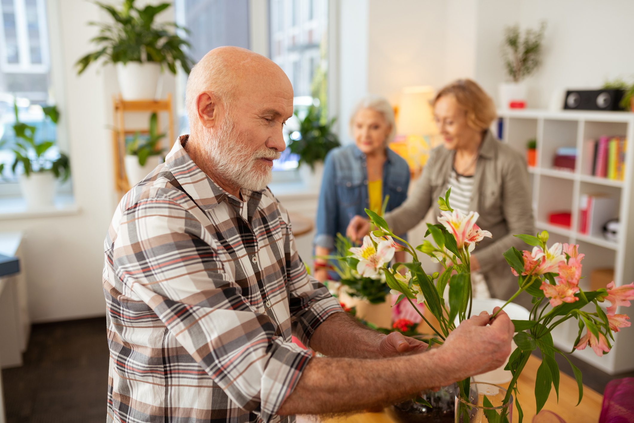 mullen residences older adults with flowers landscape
