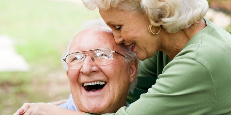 mullen residences couple hugging landscape