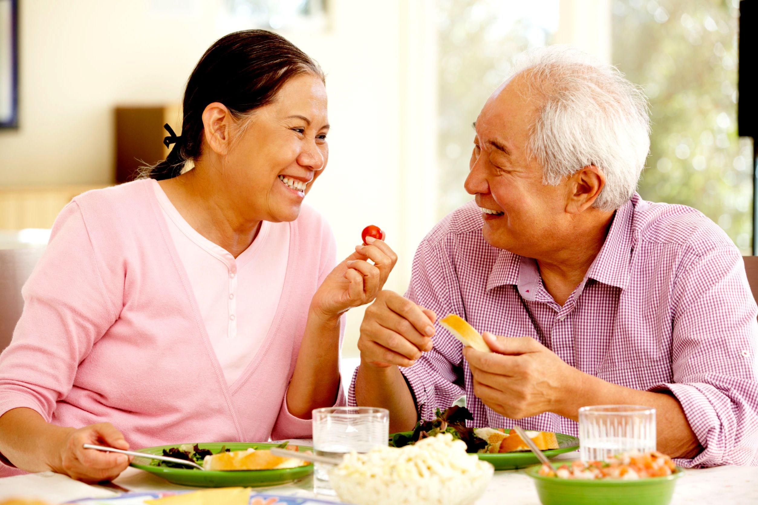 mullen residences at the highlands senior couple eating together landscape