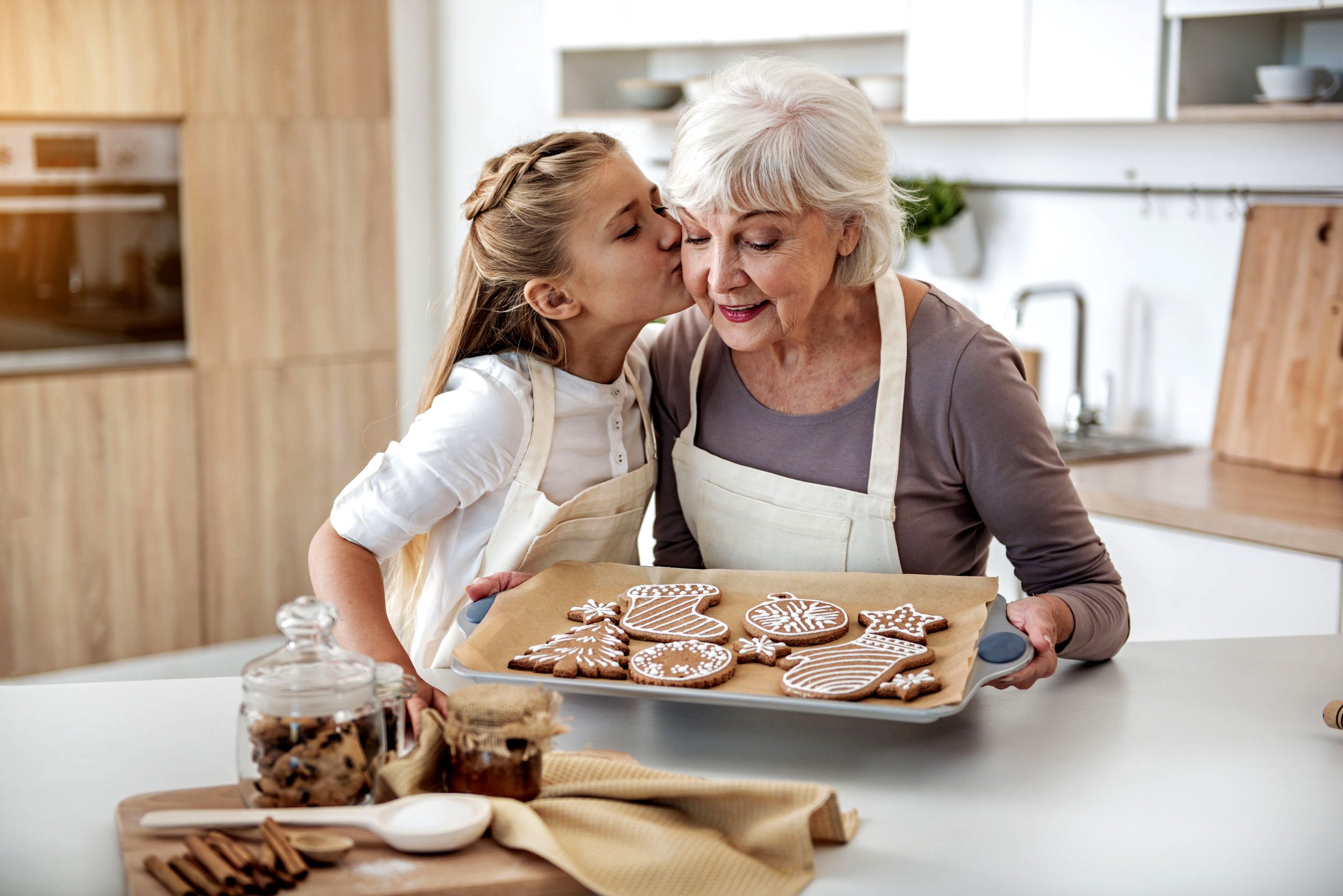 happy child thanking grandma for sweet pastry