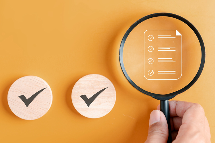 checklist with magnifying glass