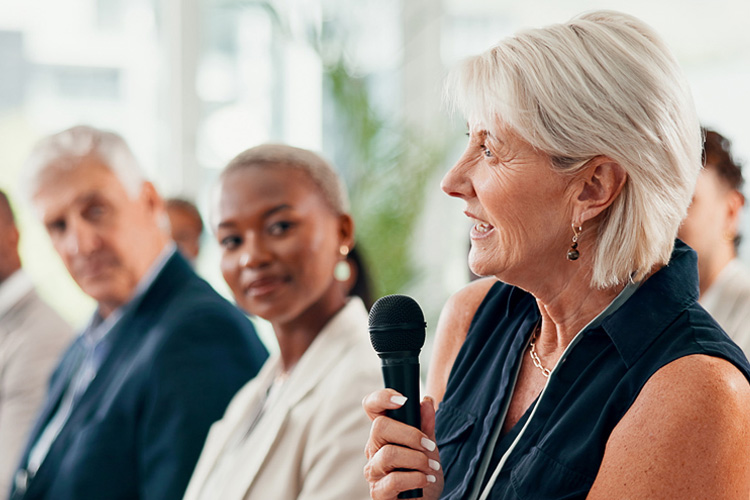mullen residences at the highlands woman in group with microphone