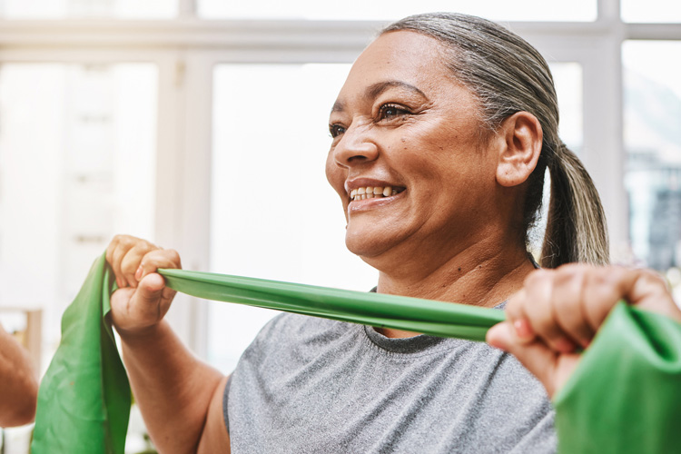 mullen residences senior woman exercising with resistance band mullen residences senior woman exercising with resistance band