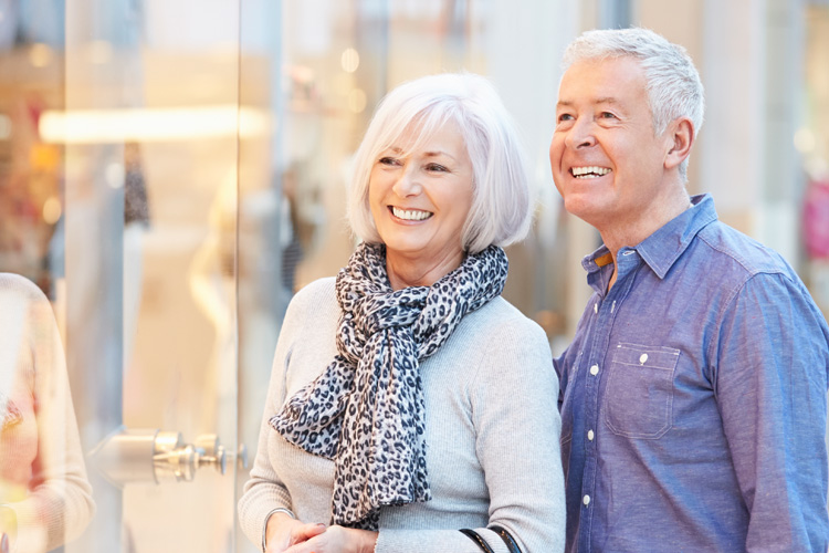mullen residences senior couple window shopping